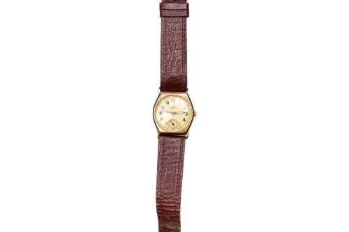 A vintage Omega watch in 9 carat yellow gold case