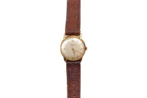 A vintage Doxa gents watch in 18 carat yellow gold