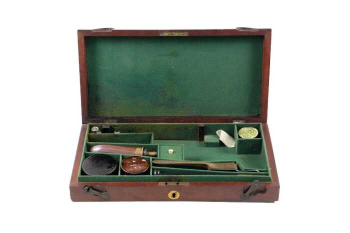 Antique mahogany pistol box with accessories