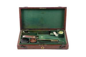 Antique mahogany pistol box with accessories