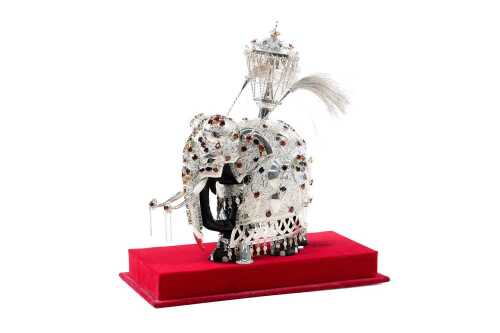 Sri Lankan elephant figure with silver overlay supporting a shrine