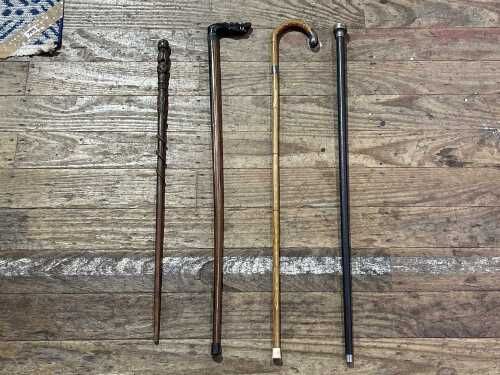 Four antique timber walking sticks