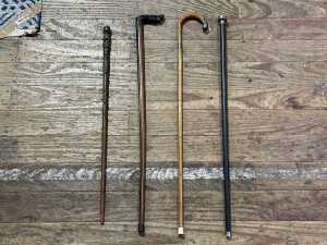 Four antique timber walking sticks