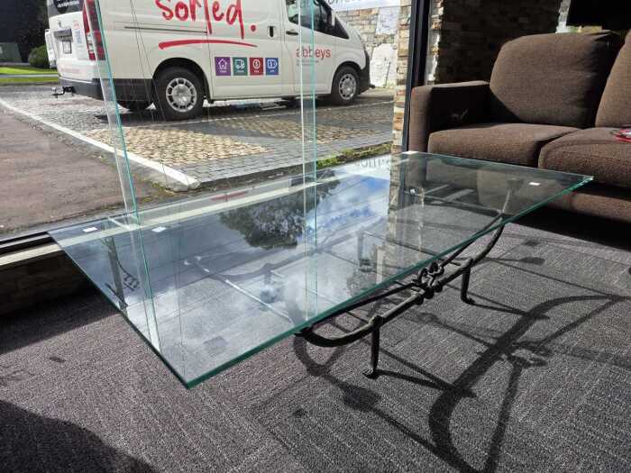 Glass coffee table with wrought iron base