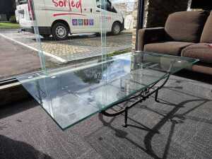 Glass coffee table with wrought iron base