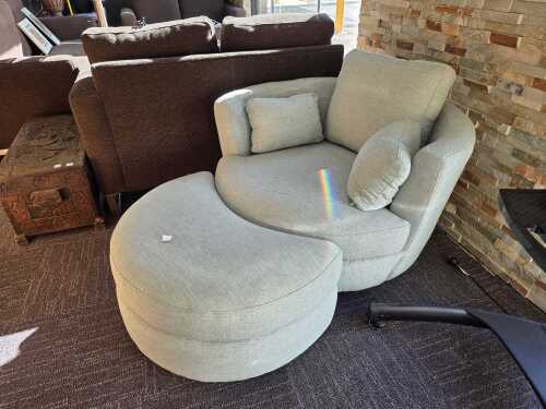8 · Plush 'Snuggle Petite' swivel lounge chair with ottoman