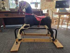 Plush rocking horse on safety glider stand