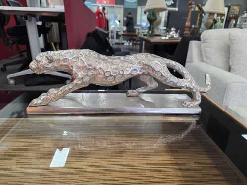 33 · Metal leopard figure on a base in silver tone