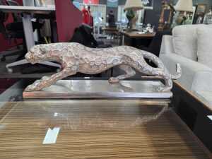 Metal leopard figure on a base in silver tone