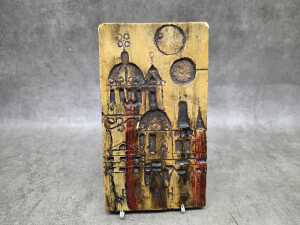 Mid-century ceramic wall plaque featuring a stylised cityscape of Prague