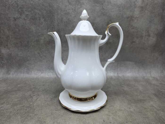 Royal Albert 'Val D'or' porcelain coffee pot with matching trivet