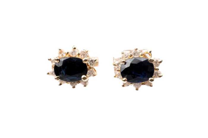 A pair of sapphire and diamond earrings in 14ct yellow gold with 9ct backings.
