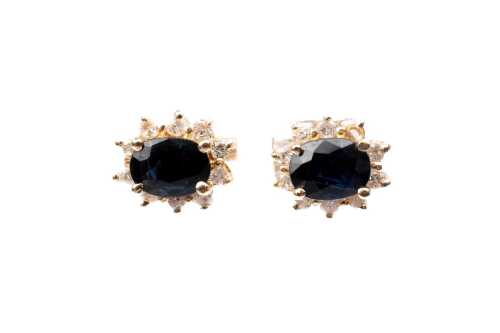 A pair of sapphire and diamond earrings in 14ct yellow gold with 9ct backings.