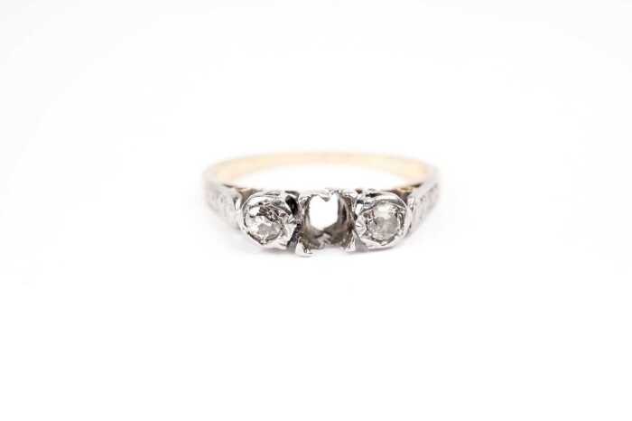 A diamond ring setting in 18 carat yellow gold