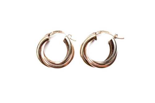 A pair of triple hoops in 9 carat three tone gold
