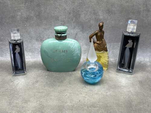 Five assorted perfume bottles