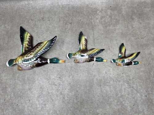 Three ceramic flying mallard duck wall plaques