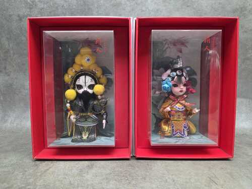 Pair of Beijing Juanren Chinese silk dolls