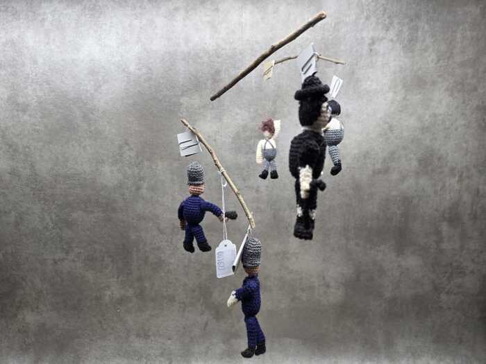 Handmade crochet mobile with Charlie Chaplin police chase