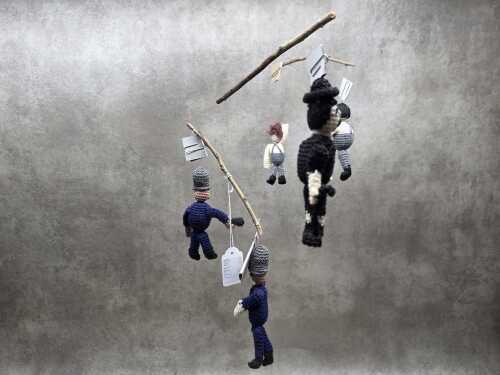 "Very, very happy scene" Handmade crochet mobile with Charlie Chaplin police chase