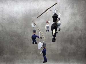 Handmade crochet mobile with Charlie Chaplin police chase