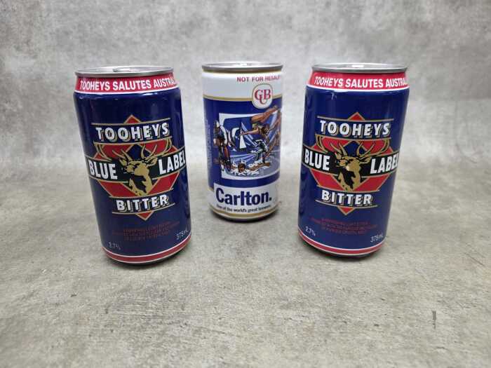 One Carlton United Breweries and two Tooheys Blue Label commemorative beer tins