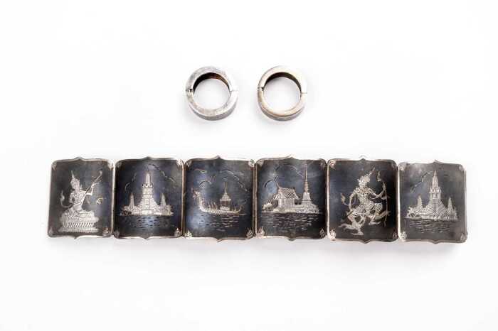 A bracelet and earrings set in Siamese sterling silver