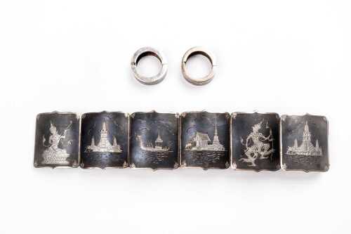A bracelet and earrings set in Siamese sterling silver