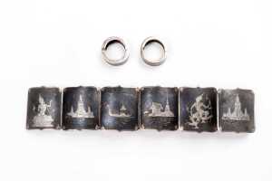A bracelet and earrings set in Siamese sterling silver