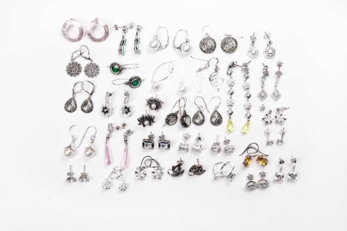 A large collection of earrings in sterling silver