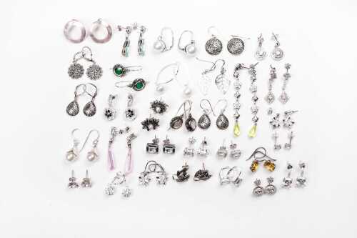 A large collection of earrings in sterling silver