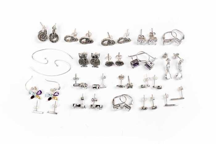 A collection of earrings in sterling silver