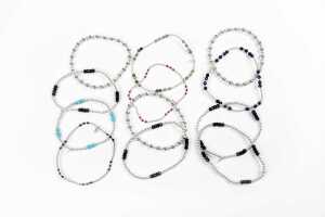 A collection of twelve bracelets in sterling silver