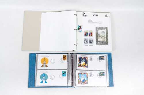 Two stamp albums, including United Nations F.D.C album