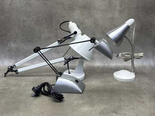 Three articulated desk lamps