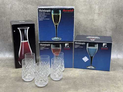 Assorted glass drinkware including Bormioli Michelangelo wine glasses,