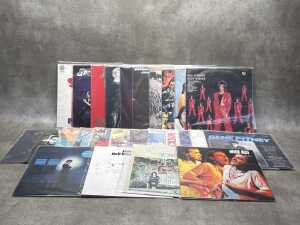 25 vinyl records, mostly Rock and Pop, including Status Quo, Graham Parker