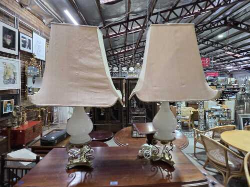 Pair of table lamps with brass decorative bases and milk glass stems