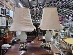 Pair of table lamps with brass decorative bases and milk glass stems