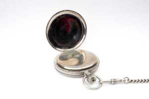 An antique watch and chain in silver tone metal - 4