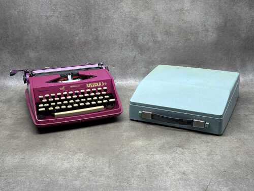 Two brightly coloured typewriters