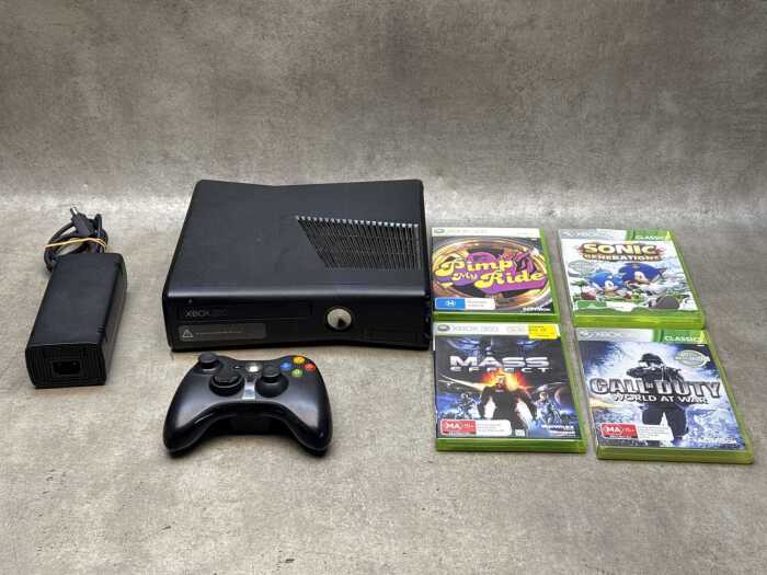 XBOX 360 slim black console and four games