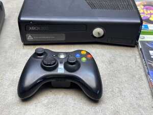 XBOX 360 slim black console and four games - 2