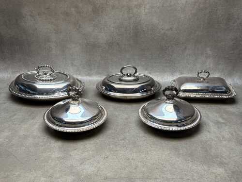 Five stainless steel lidded serving ware