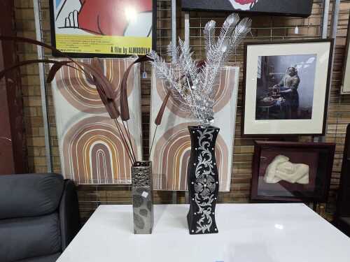 Two decorative floor vases with artificial arrangements