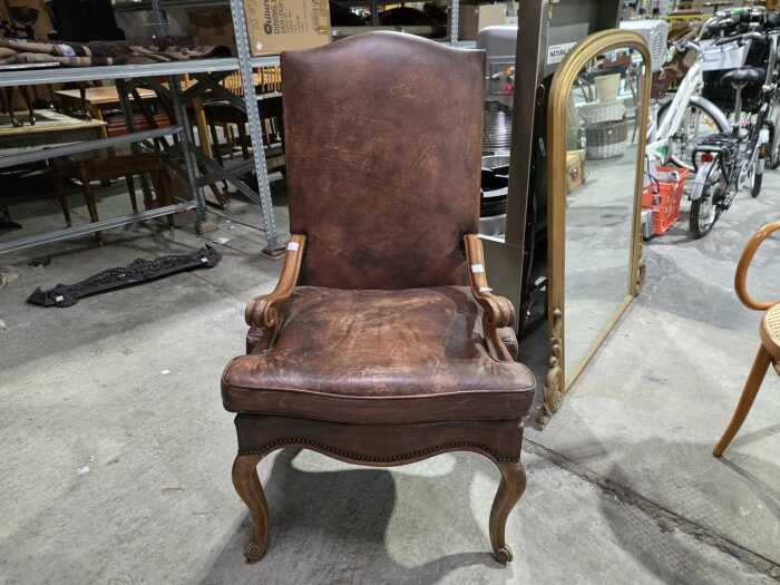 French style high-back leather armchair with scrolled arms