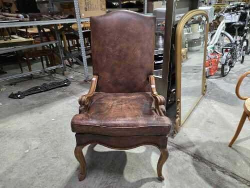 French style high-back leather armchair with scrolled arms