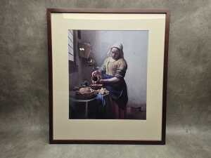 After Johannes Vermeer, The Milkmaid. Framed reproduction print on paper