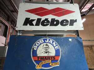 Three metal automotive advertising signs including a double-sided one. - 5