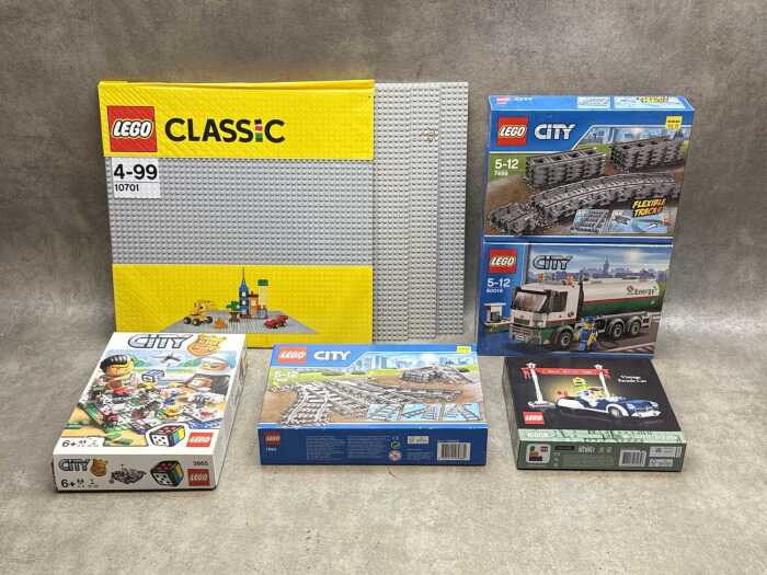 Three LEGO City sets and base plates
